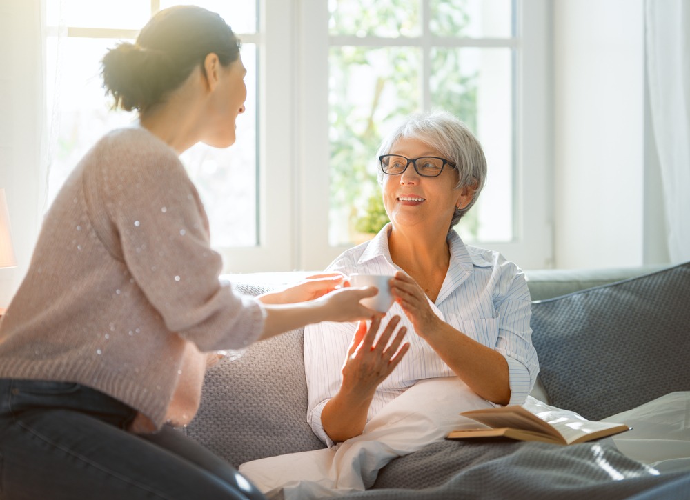 Beautiful,Senior,Mother,And,Adult,Daughter,Are,Talking,And,Smiling